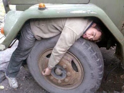 25 People Caught Sleeping In Funny & Uncomfortable Positions 13 Sleeping on tires