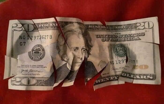 27 Terrifying Images That Show What Its Really Like To Be A Parent 7 cutting money