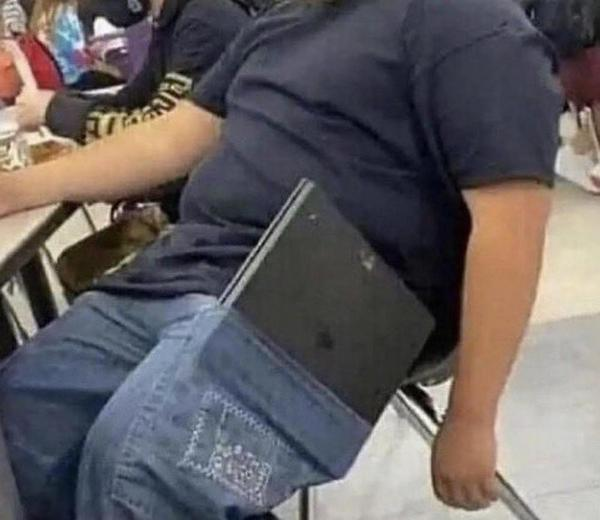 20 Photos That Raise More Questions Than Answers 10 laptop in pocket - Photos That Raise More Questions Than Answers