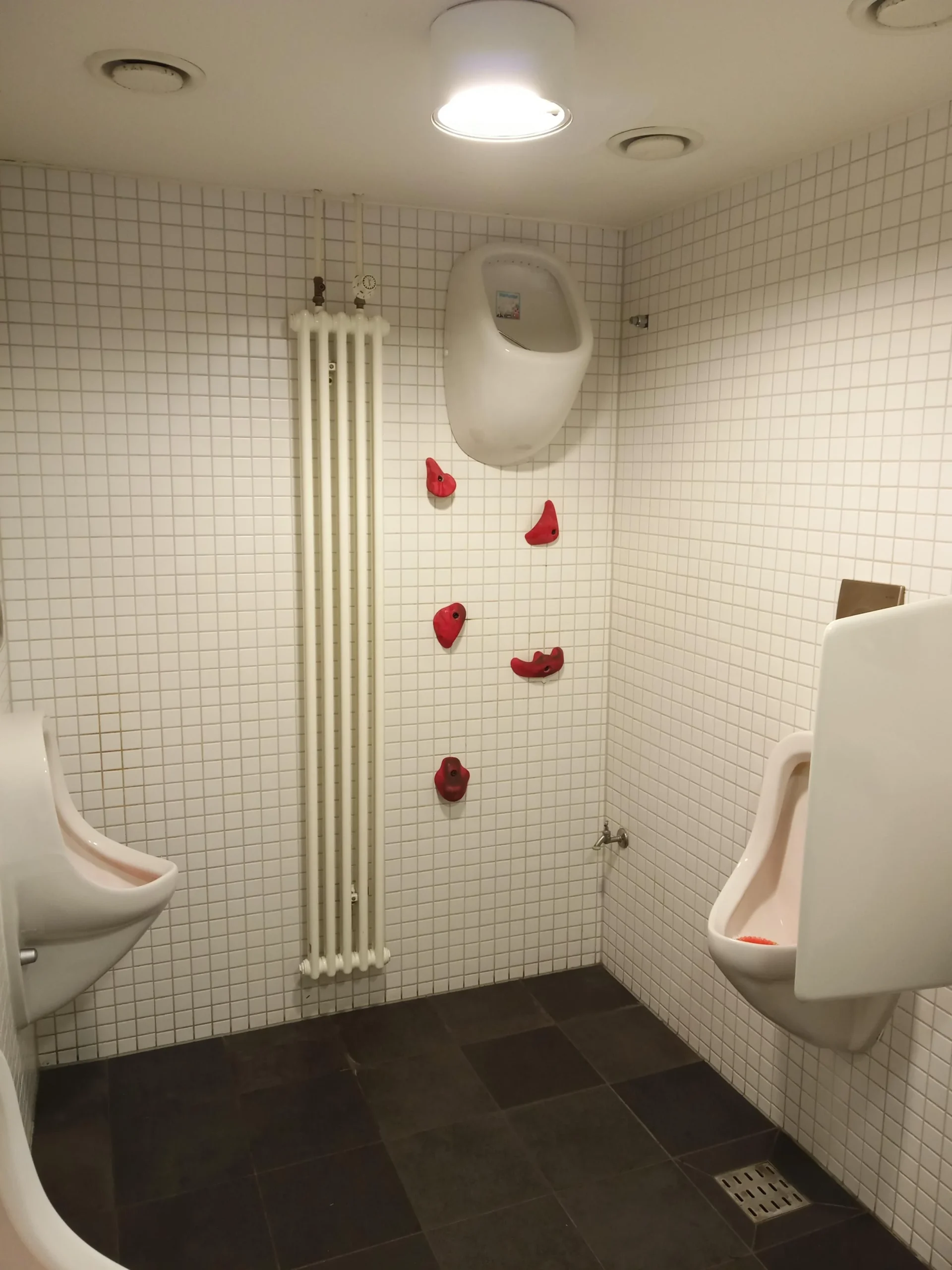 A men's bathroom in a restaurant. Art installation. - Bathroom Humor