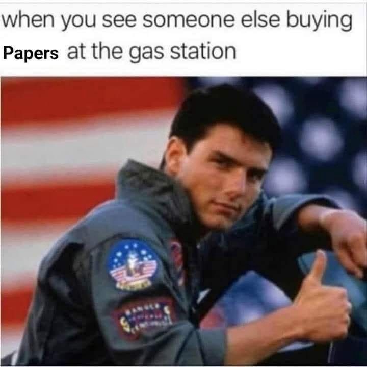 Someone buying papers